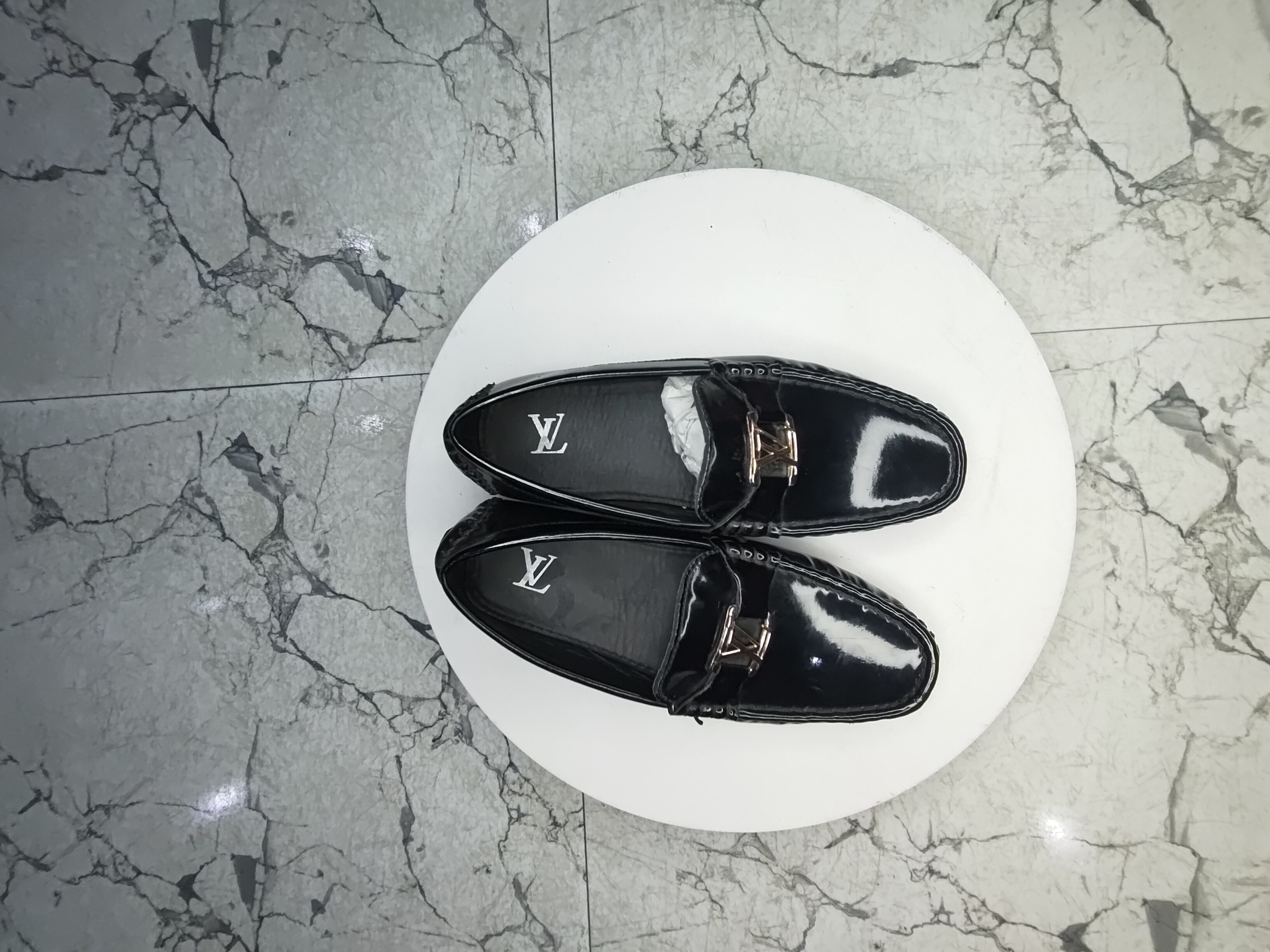 Louis Vuitton patent covered shoe